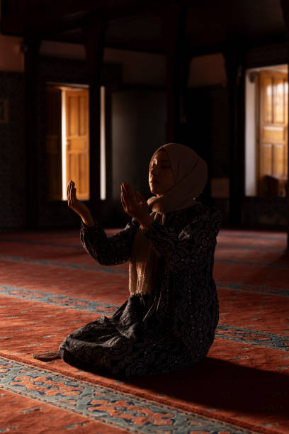 istock Woman Muslim praying in a mosque. 1606060171