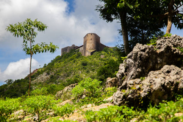 The Citadelle La Ferrière, is a military structure built in the early 19th century at Milot in Haiti's North Department by Henri Christophe, president and later king of the country. It is the largest fortress on the American continent1 : at an altitude of 900 metres, it is located 15 km south of Cap-Haïtien, in the heart of the Citadelle, Sans Souci, Ramiers National Historic Park, a UNESCO World Heritage Site since 1982. The fortress could house a garrison of 2,000 men, rising to 5,000 in times of need. citadel haiti photos stock pictures, royalty-free photos & images