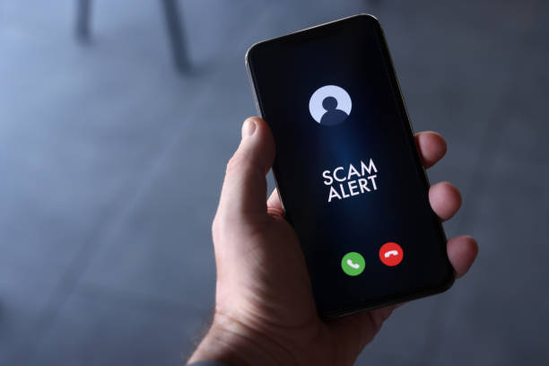 Scam alert on mobile phone screen Scam incoming call alert screen on mobile phone. phone spam stock pictures, royalty-free photos & images