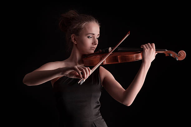 istock Young woman playing violin 160613152