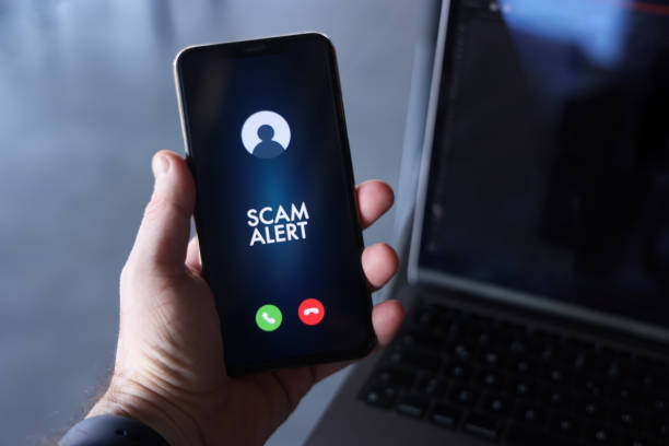 Scam alert on mobile phone screen Scam incoming call alert screen on mobile phone. phone spam stock pictures, royalty-free photos & images