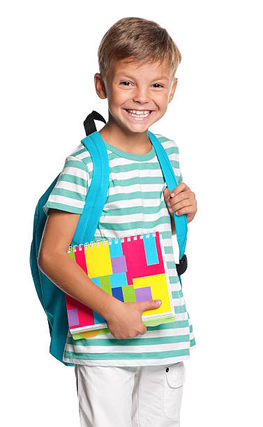istock Happy little boy ready for school holding his books 160614904