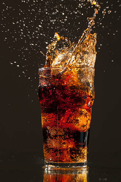 istock Pint of Cola with ice cube splash, Isolated on Grey 160615015