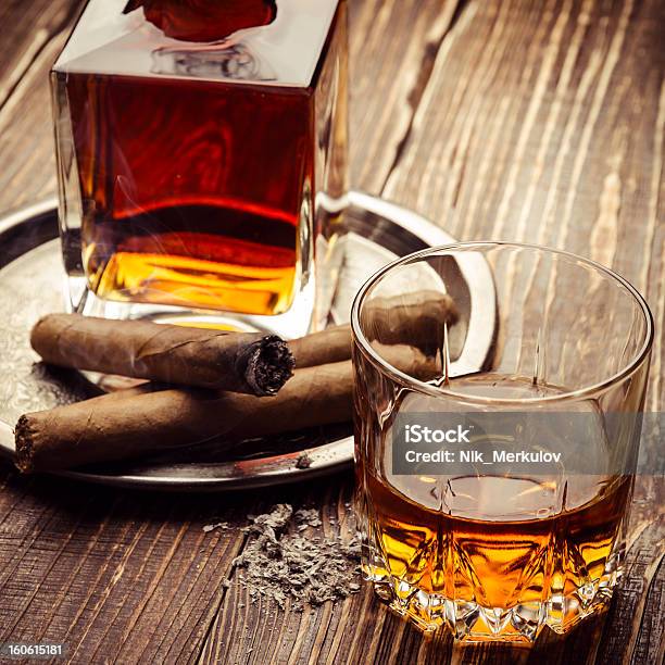 Vintage Cognac And A Burning Cigar Next To It Stock Photo - Download Image Now - Adult, Alcohol - Drink, Alcohol Abuse