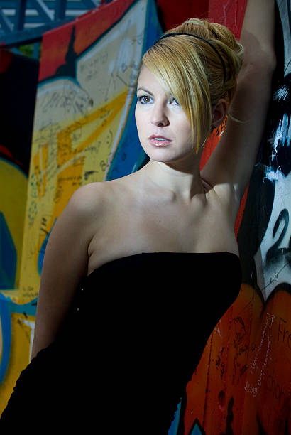 Young attractive blond woman with black dress  hochsteckfrisur stock pictures, royalty-free photos & images