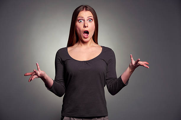 istock worried woman over dark background 160617951