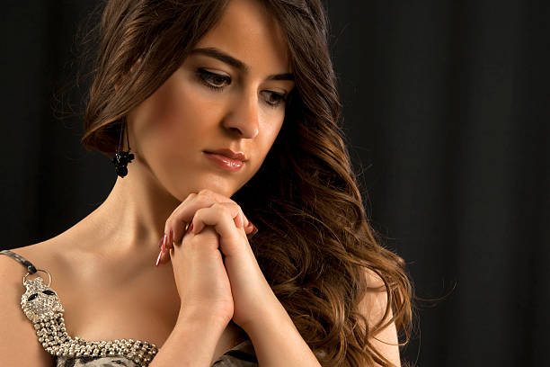 istock beautiful young women is thinking 160618581