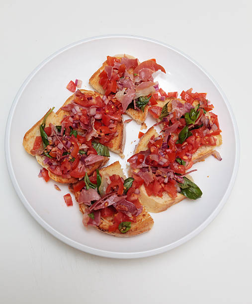 ブルスケッタ - cherry tomato crostini mediterranean cuisine breaded fish ストックフォトと画像