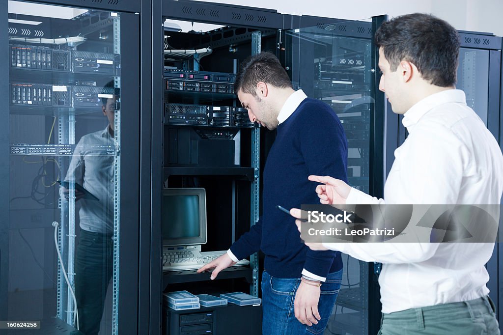 Two It Engineering Working On A Server Stock Photo - Download Image Now ...