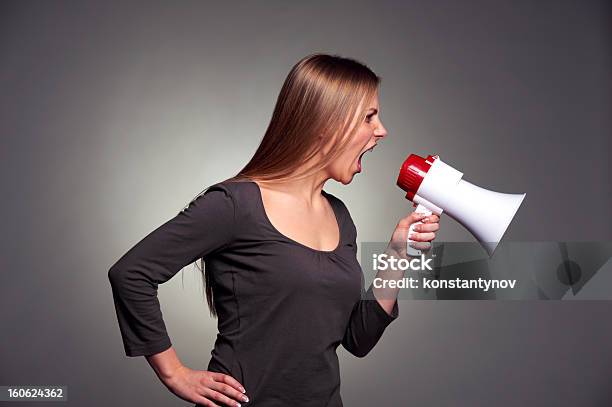 Woman Shouting In Loudspeaker Stock Photo - Download Image Now - 20-29 Years, 30-39 Years, Adult