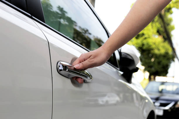 istock Male hand opening car door 1606259441
