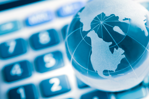 Globe on calculator, america map, concept for business and finance