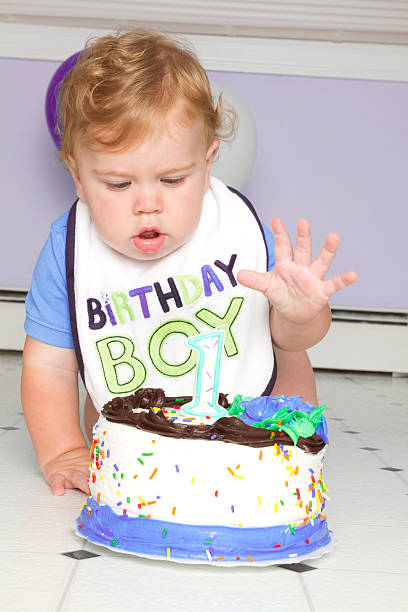 istock baby with first birthday cake 160631318