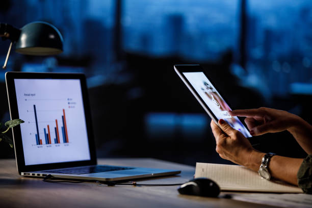 istock Woman sitting at her desk at the office, using digital tablet 1606318199