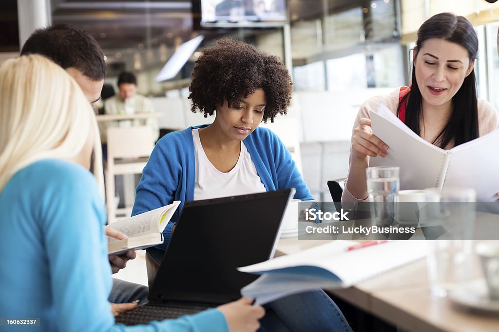 Students sitting at the table and study Young teenagers students sitting at the table and study Adolescence Stock Photo