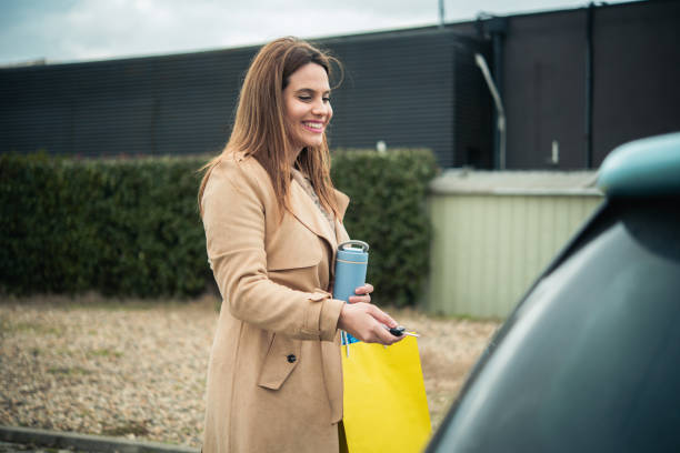 istock Happy woman coming back from shopping 1606324141