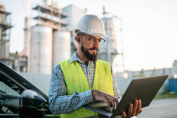 istock Engineer using a laptop while working in the oil and gas industry. 1606326365