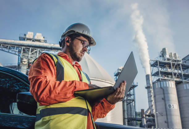 istock Hard working engineer on the power station with laptop. 1606326389