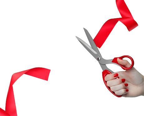 Cutting a red ribbon. isolated on white with clipping path