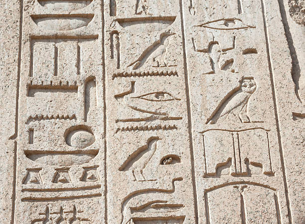 istock Egyptian hieroglyphic carvings on wall 160634208