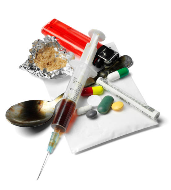 Drugs and Needle Syringe and heroin,with pills. isolated on white with clipping path. narcotic stock pictures, royalty-free photos & images