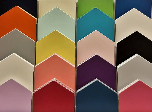 istock Color swatch paint sample cards on display in a hardware store. 1606366774
