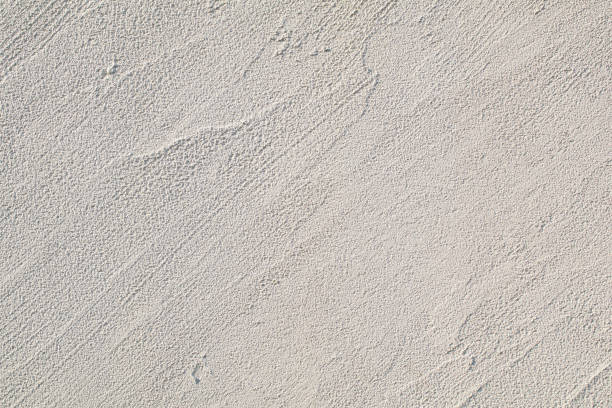 istock Empty cement wall background. Abstract tropical sunlight texture. Minimal exotic concept. Stone wall marble. Horizontal architecture wallpaper 1606385382