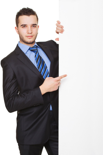 businessman gesturing that hes advertisement was a succes against white studio background