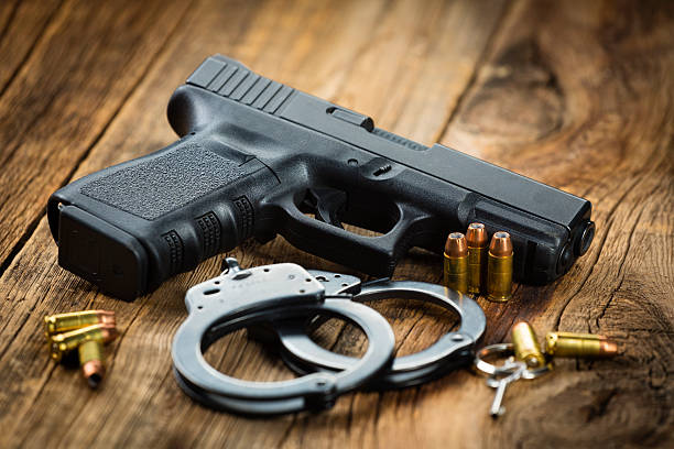 istock Pistol and Handcuffs 160641660