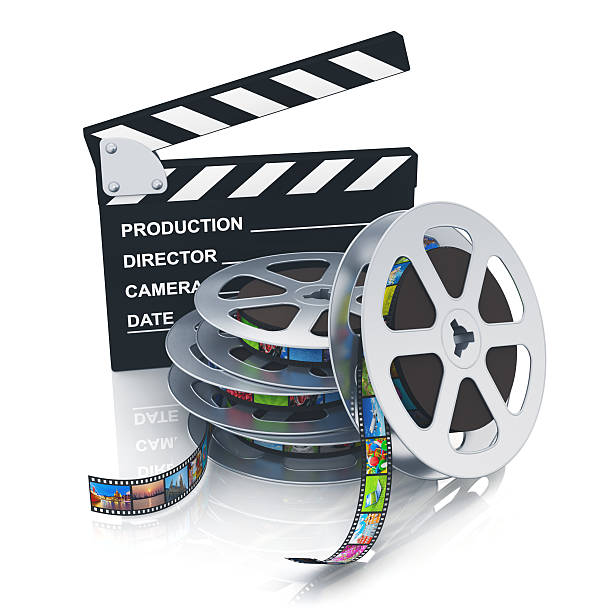istock Clapper board and reels with filmstrips 160641737