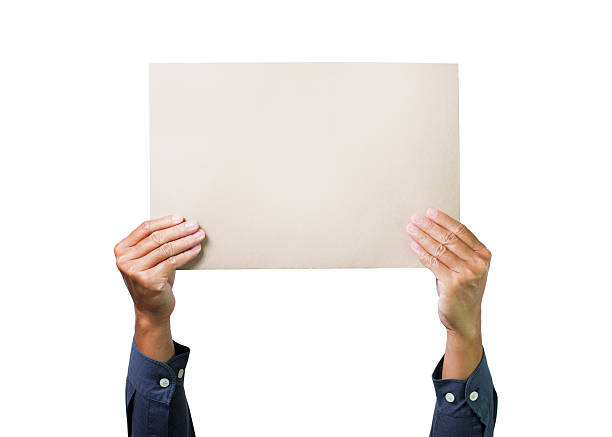 istock Two hands holding brown paper cardboard overhead on white background 160642053
