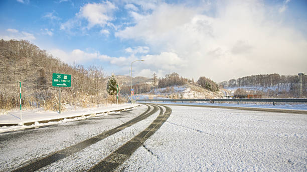 istock snowy road on winter time in japan 160644340