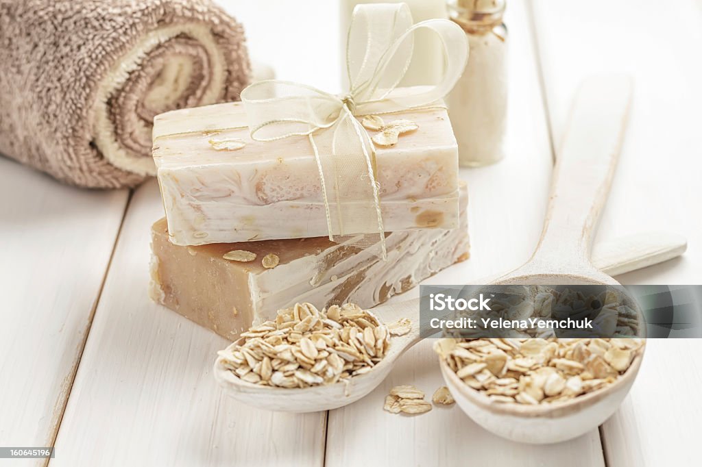 Selection of oatmeal colored items and cereal Oatmeal soap Homemade Stock Photo