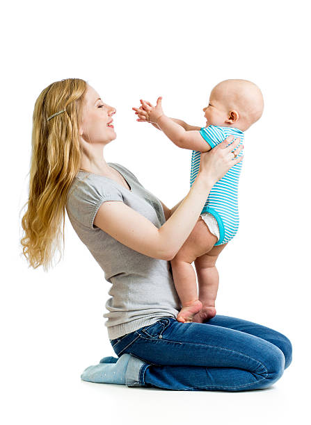 istock loving mother holding baby boy isolated on white 160647376