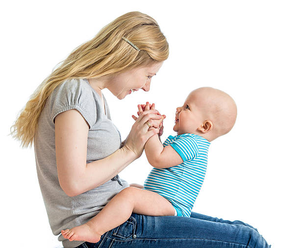 Loving mother having fun with her baby boy