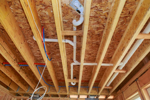 istock Installing pvc plastic drain pipe water piping system for new home during under a construction 1606496189