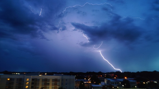 Lightning bolts spider through the clouds and strike the ground near the midlands of South Carolina