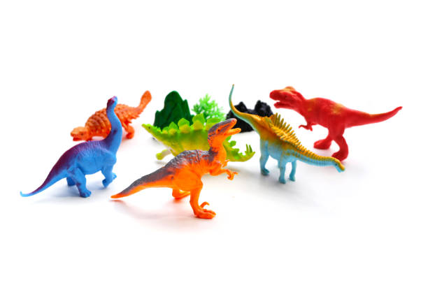 istock Plastic dinosaur toys on white background. Top view 1606534929