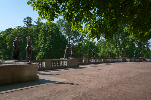 View of the granite terrace with statues in the Catherine Park of Tsarskoye Selo on a sunny summer day, Pushkin, St. Petersburg, Russia