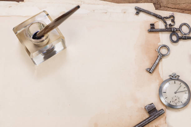 old papers and pen with vintage pocket watch background