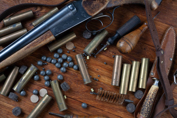 istock Hunting shotgun with brass cases and accessories for cartridge reloading. 1606553826