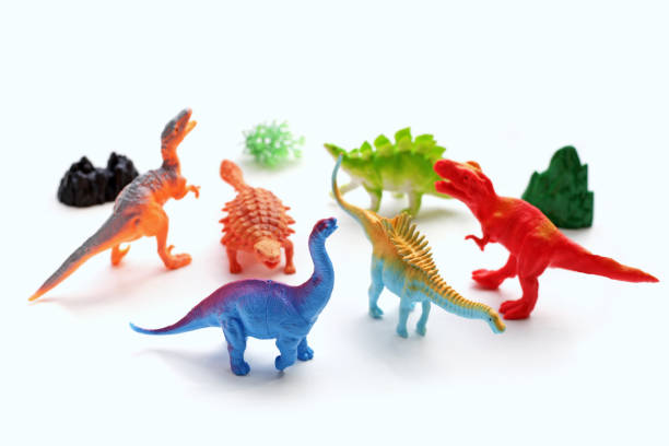 istock Plastic dinosaur toys on white background. Top view 1606600800
