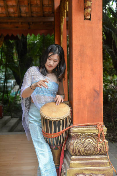 istock A woman is playing the drums 1606606533