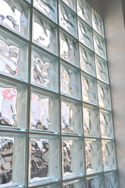 istock close up glass block wall with golden natural light background, interior design 1606619933
