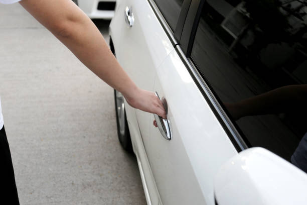 istock Male hand opening car door 1606637875