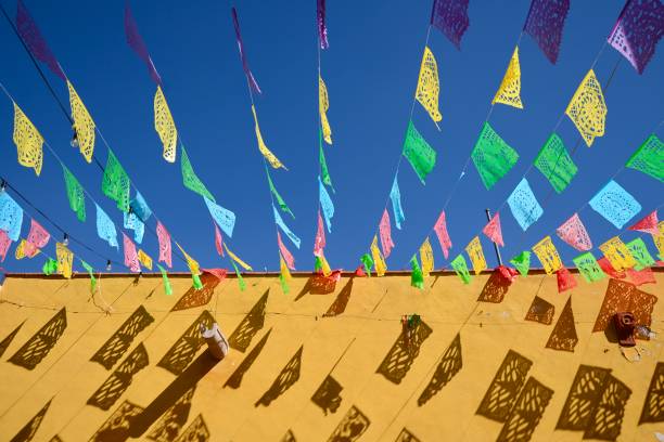 istock Colourful Flags Blowing in the Wind in Mexico 1606717602
