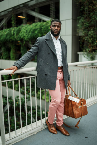 istock Businessman with luggage while on business trip commute 1606720258