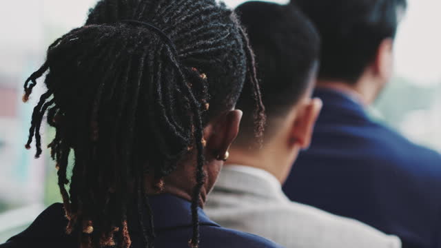 Shot of the back of the head of a young adult male with dreadlocks