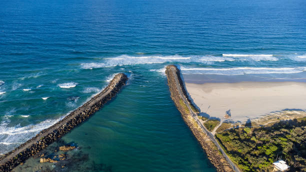 Aerial view of the river mouth Aerial view of the breakwall at Brunswick Heads, NSW, Australia near Byron Bay brunswick heads nsw stock pictures, royalty-free photos & images