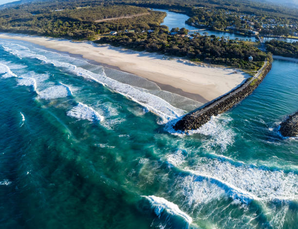 Aerial view of the river mouth Aerial view of the breakwall at Brunswick Heads, NSW, Australia near Byron Bay brunswick heads nsw stock pictures, royalty-free photos & images